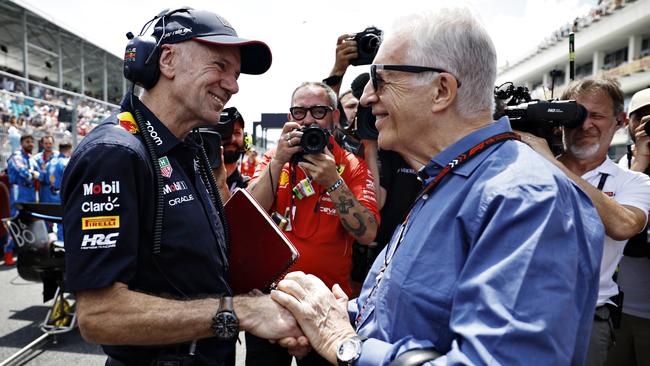 Adrian Newey, the Chief Technical Officer of Oracle Red Bull Racing shakes hands with Piero Ferrari on the grid in Miami. (Photo by Chris Graythen/Getty Images)