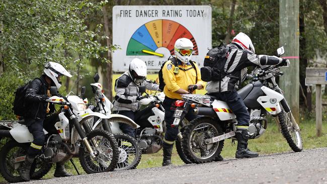 Searchers head out on motorbikes. Picture: Tim Hunter