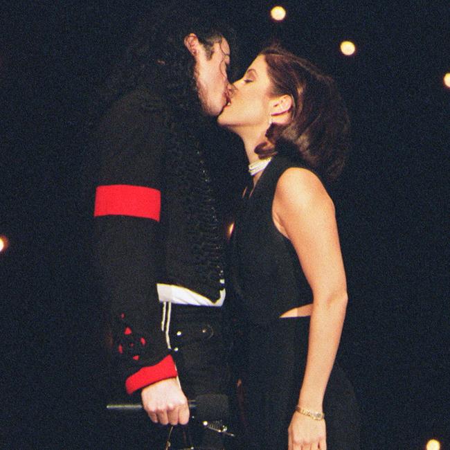 Michael Jackson and his then wife Lisa-Marie Presley kissing on the stage of Radio City Music Hall in New York where they attended the MTV Video Music Awards. Picture: AFP