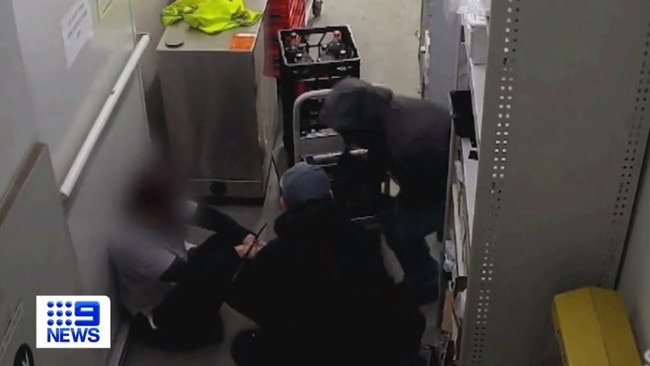 Terrifying new security footage has emerged of a robbery at Port Wakefield, showing staff members cable-tied, as police appeal for information. Picture: 9 News.