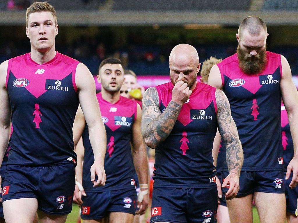 MELBOURNE, AUSTRALIA - AUGUST 12:  Nathan Jones of the Demons (C) looks dejected after defeat during the round 21 AFL match between the Melbourne Demons and the Sydney Swans at Melbourne Cricket Ground on August 12, 2018 in Melbourne, Australia.  (Photo by Michael Dodge/Getty Images)