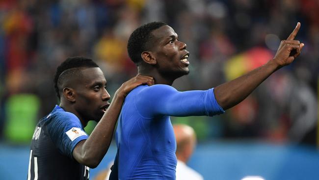 France's midfielder Blaise Matuidi (L) and France's midfielder Paul Pogba celebrate the team's victory in the Russia 2018 World Cup semi-final football match between France and Belgium at the Saint Petersburg Stadium in Saint Petersburg on July 10, 2018. / AFP PHOTO / Paul ELLIS / RESTRICTED TO EDITORIAL USE - NO MOBILE PUSH ALERTS/DOWNLOADS