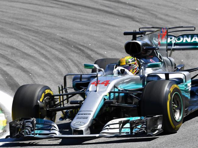 Mercedes' British driver Lewis Hamilton powers his car during the Brazilian Formula One Grand Prix, at the Interlagos circuit in Sao Paulo, Brazil, on November 12, 2017. / AFP PHOTO / EVARISTO SA