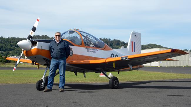 Gary Herne with his CT-4 basic trainer. He flew from Sydney to Lismore to train pilots after being stood down from Qantas during the pandemic.