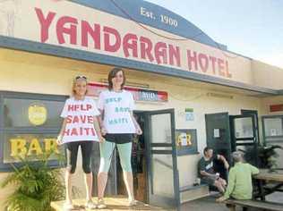 Jessy McKinnon and Mikayla Marschke raise money for Haiti victims at the Yandaran Hotel. Photo: Contributed