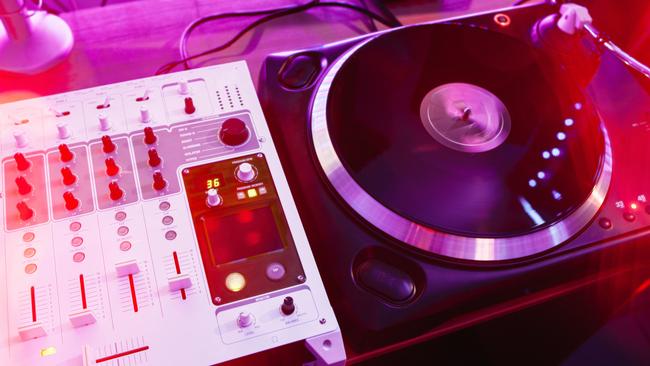 Old school vinyl player and mixer in sound studio or concrete floor with nobody