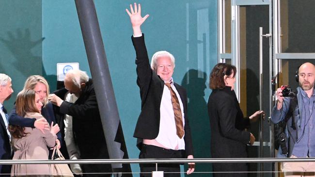 Julian Assange waved to the crowd after stepping off the plane. Picture: NewsWire / Martin Ollman
