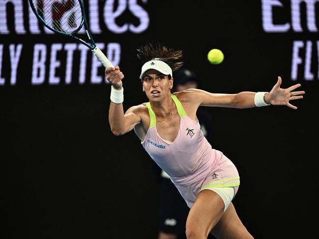 Australia's Ajla Tomljanovic hits a return against Croatia's Petra Martic in their women's singles match on day three of the Australian Open tennis tournament in Melbourne on January 17, 2024. (Photo by Lillian SUWANRUMPHA / AFP) / -- IMAGE RESTRICTED TO EDITORIAL USE - STRICTLY NO COMMERCIAL USE --