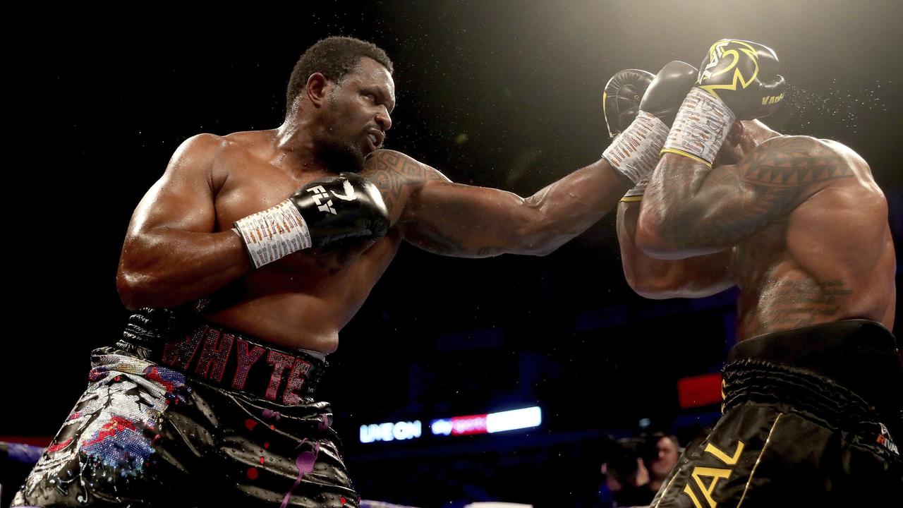 Dillian Whyte, left, in action against Oscar Rivas, right, in the WBC interim Heavyweight title fight at the O2 Arena.