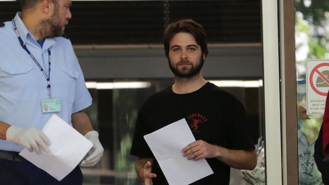 Thomas Elliott (right), who has been charged over the alleged spiking incident in Newtown, leaves Surry Hills police station after being released on bail. Picture: Christian Gilles