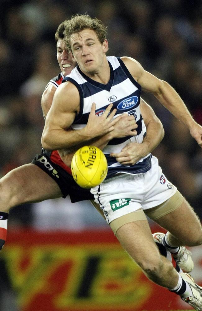 Lenny Hayes earns himself a free kick after laying a strong tackle on Joel Selwood.