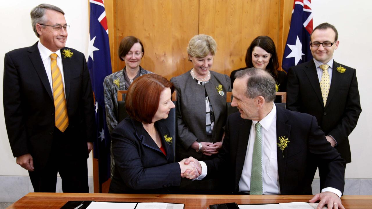 Then Prime Minister Julia Gillard shakes hands with Greens Leader Senator Bob Brown as after signing of an agreement between the Labor Party and the Greens at Parliament House in Canberra in 2010. Picture: Ray Strange