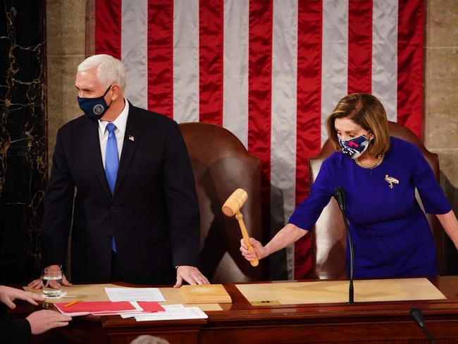 Speaker of the House Nancy Pelosi (R) and Vice President Mike Pence (L) convene a joint session of Congress to certify Joe Biden as the next US president in the US capitol in Washington, DC. Picture: AFP