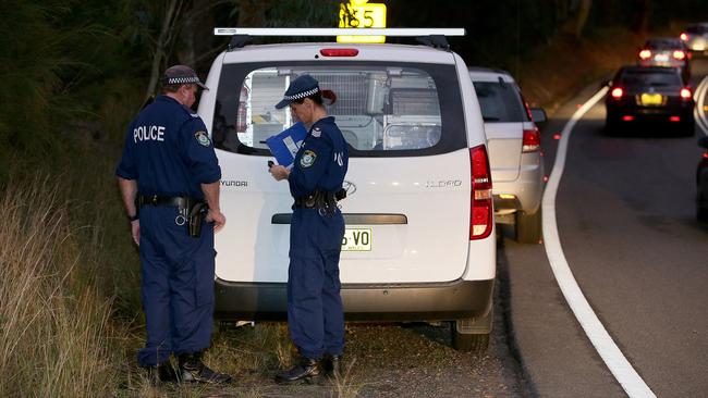 NSW Police are present near Cowan on the Pacfic Highway where a body was found this afternoon. Photographer: Troy Snook