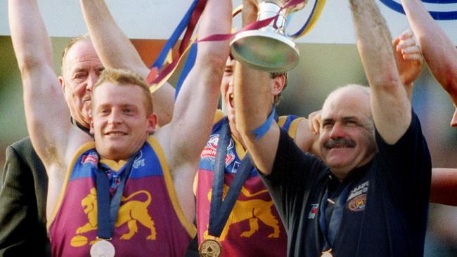 Leigh Matthews and Michael Voss enjoy their first win of the three-peat.