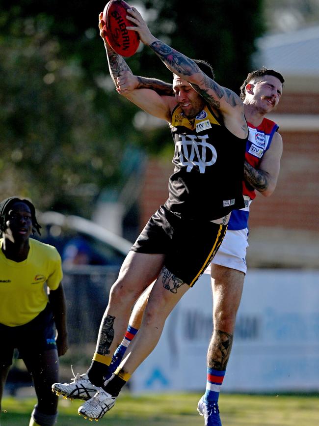 WRFL: Werribee Districts’ Daniel Schibeci marks in front of Chris Sivanesan of Point Cook. Picture: Andy Brownbill