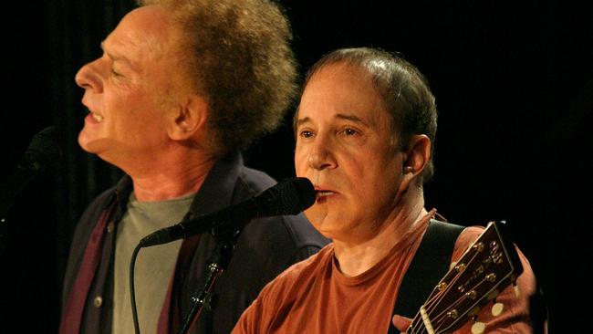 Paul Simon and Art Garfunkel perform during their "Old Friends" concert tour in 2003.