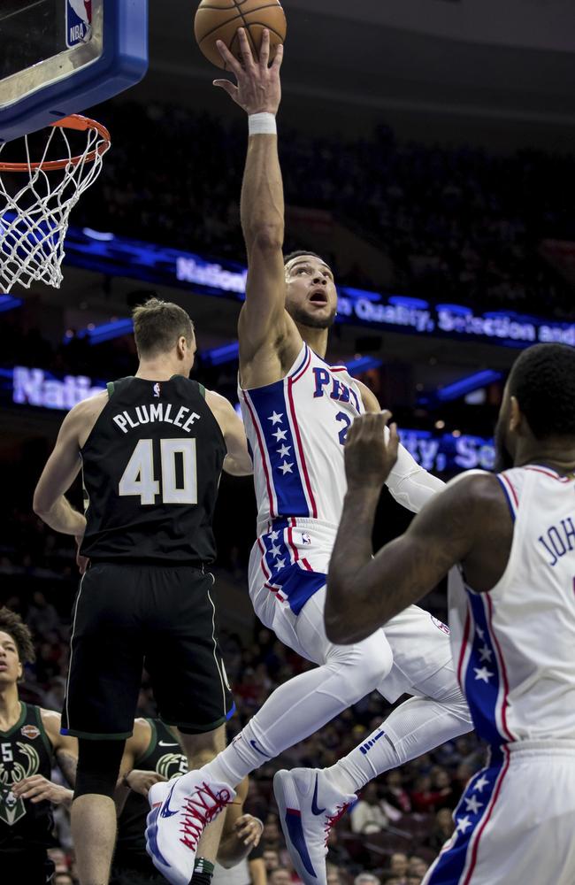 American dream: Philadelphia 76ers’ Ben Simmons shoots after getting past Milwaukee Bucks’ Marshall Plumlee (left). The 76ers won 116-94 on Saturday. Picture: AP