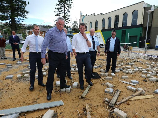 Premier Mike Baird surveys the damage at Collaroy with Brad Hazzard, member for Wakehurst. Picture: John Grainger.