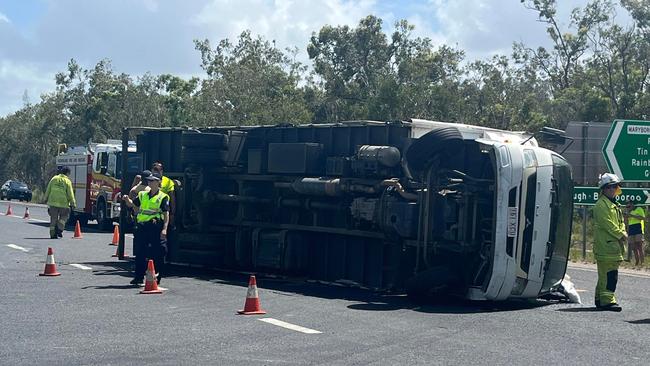 Multiple emergency services attended the scene of a truck rollover at Boonooroo Plains.