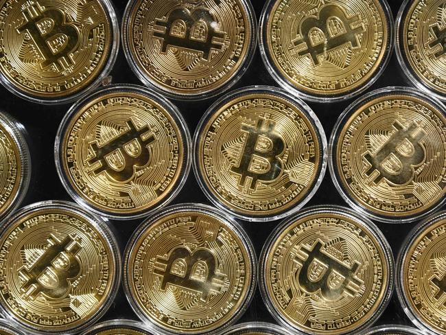 (FILES) File photo taken on September 24, 2020 showing a physical imitation of a Bitcoin at a crypto currency 