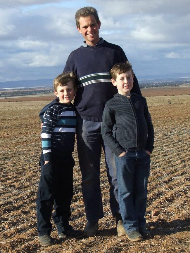 Andrew Harrison with sons Thomas (right) and Henry (left), who are now in their teenage years, on the family farm at Mount Templeton, 2012. Picture: Supplied by family