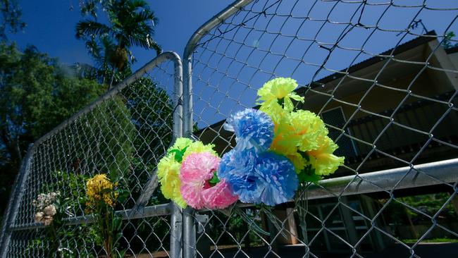 Floral tributes at the scene of an alleged murder in Driver, on October 8. Picture: Glenn Campbell