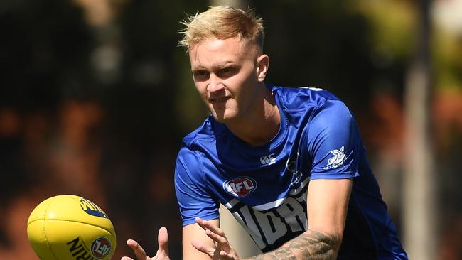 MELBOURNE, AUSTRALIA - MARCH 06: Jaidyn Stephenson of the Kangaroos warms up during the AFL Community Series match between the Hawthorn Hawks and the North Melbourne Kangaroos at Arden Street Ground on March 06, 2021 in Melbourne, Australia. (Photo by Quinn Rooney/Getty Images)