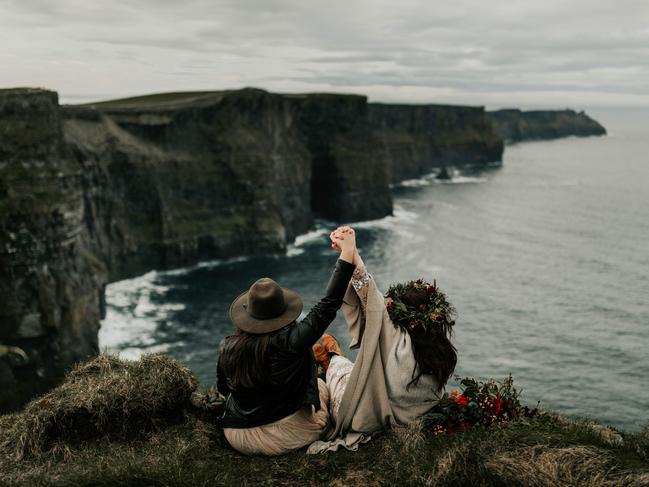 Summer Ghantous from Summer Leigha Photo captured this happy couple holding hands on the top of the Cliffs of Moher in Ireland.