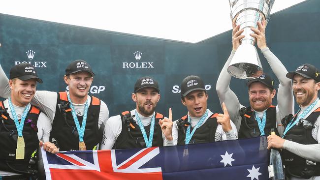 Jason Waterhouse, third from left, and Ky Hurst, fourth from left, celebrating with teammates.