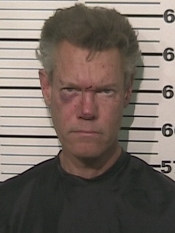 Randy Travis is seen in a police booking photo August 7, 2012 in Sherman, Texas. Travis was charged with misdemeanor DWI and felony Retaliation after he was involved in a one vehicle accident. He was later released on bond. (Photo by Grayson County Sheriff’s Office via WireImage)