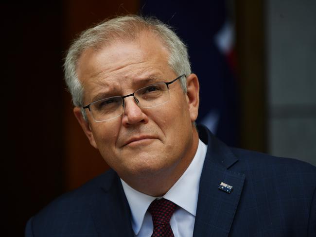 CANBERRA, AUSTRALIA - NOVEMBER 13:  Prime Minister Scott Morrison holds a news conference in the prime minister's courtyard on November 13, 2020 in Canberra, Australia. Morrison urged the national cabinet to reopen all of AustraliaÃ¢â¬â¢s state borders by Christmas as Covid-19 cases plummet, with only 12 newly diagnosed cases and 81 active cases nationally as of November 12. Additionally Victoria has achieved 14 consecutive days of no new cases being reported. (Photo by Sam Mooy/Getty Images)