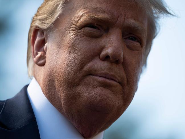 (FILES) In this file photo taken on September 30, 2020 US President Donald Trump speaks to the press as he departs the White House in Washington, DC. - US President Donald Trump said early on October 2, 2020 that he and First Lady Melania had tested positive for the coronavirus. (Photo by ANDREW CABALLERO-REYNOLDS / AFP)