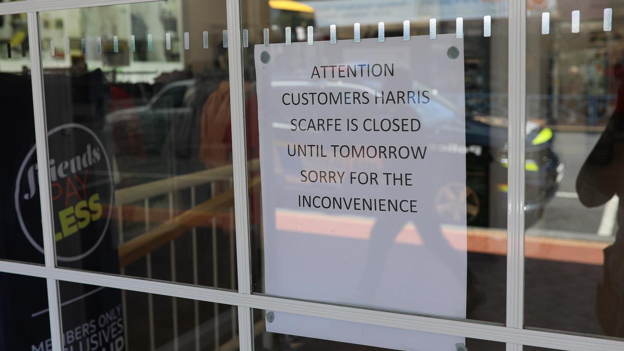 A sign placed in the window of Harris Scarfe in Moonah after an alleged stabbing. Picture: Mireille Merlet