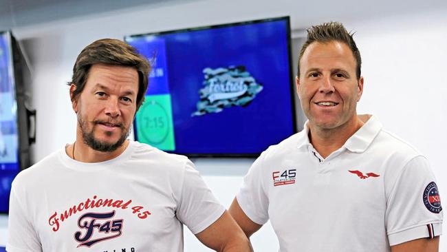 F45 owner Rob Deutsch, right, with actor Mark Wahlberg, who bought a minority stake in the company in 2019. Picture: Instagram/F45 Training