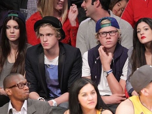 Jake Thrupp (scratching face) with Cody Simpson, wedged between Kendall and Kylie Jenner at the Staples Centre. Picture: Instagram