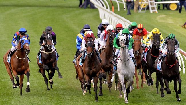 Super Cool and Fiorente (left) are caught wide shortly after the start. Picture: Jay Town