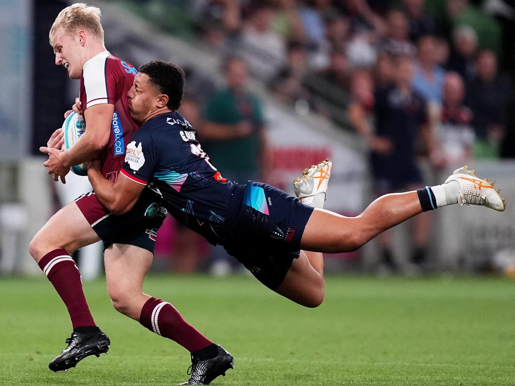 Tom Lynagh of the Reds is tackled by Glen Vaihu of the Rebels during the round four Super Rugby Pacific match. Picture: Asanka Ratnayake/Getty Images