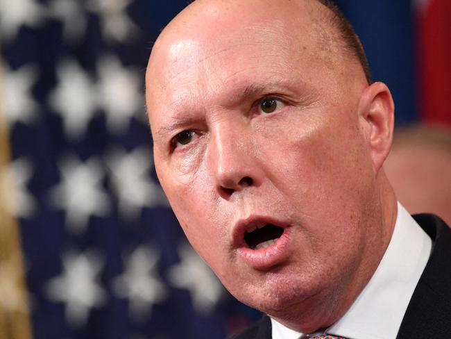 (FILES) A file photo taken on March 5, 2020 shows Australia's then-Home Affairs Minister Peter Dutton during a press conference at the Department of Justice in Washington, DC. - Dutton, who became Australia's new defence minister on March 29, 2021, is a hardline ex-cop who has overseen a controversial refugee policy, riled close ally New Zealand by deporting criminal Kiwis and publicly clashed with the Chinese government. (Photo by Mandel NGAN / AFP)