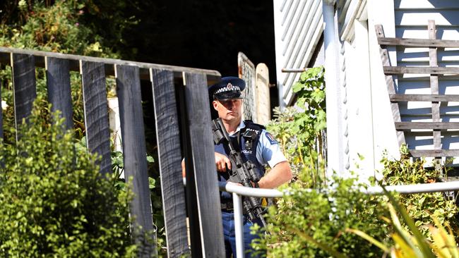 A police officer outside the house where Brenton Tarrant resided in Dunedin. Picture: Gary Ramage