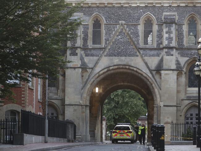 Police work at Forbury Gardens in the town centre of Reading, Englan. Picture: AP