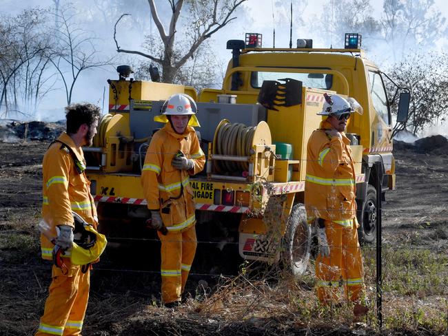 Scrub fire at Julago, just south of Townsville, causes delays to traffic on Bruce Highway. Rural Fire fighters from Nome. Picture: Evan Morgan