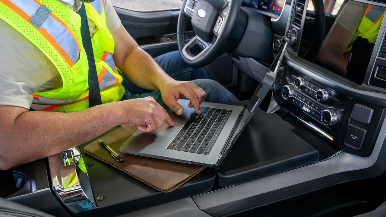 The car’s centre console flips forward to become a workspace.