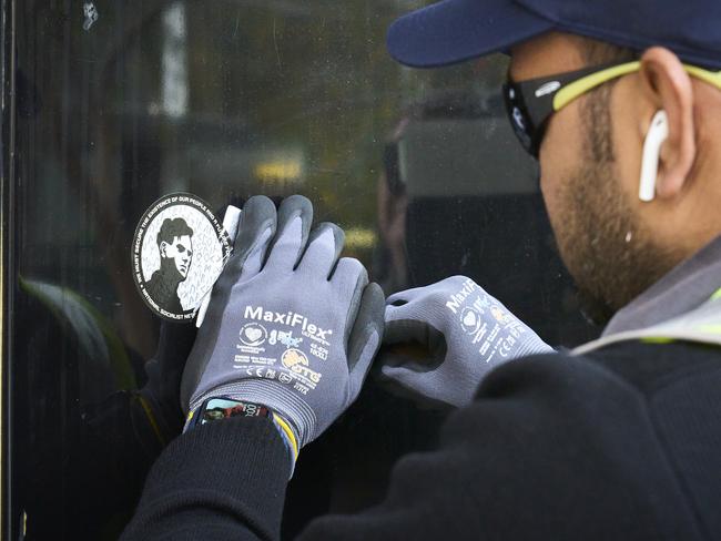 Neo-Nazi material being removed from shopfronts in Rundle Mall, Monday, July 5, 2021. Picture: MATT LOXTON