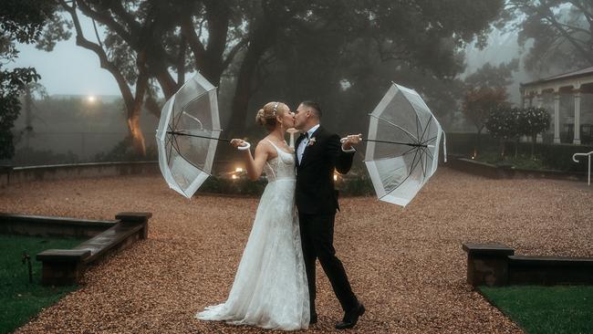 Ashlee Fleming and Cameron Stevenson eventually tied the knot in Toowoomba after their original venue in Brisbane was destroyed by fire. Picture: Feather and Finch Photography