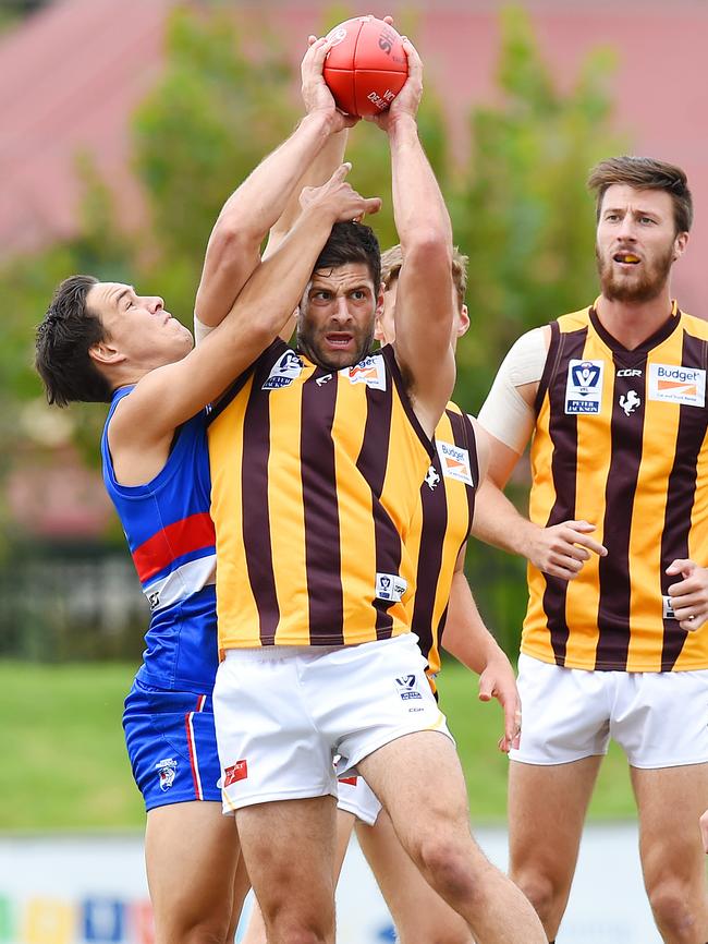 Footscray's Lukas Webb attempts to spoil Box Hill's David Mirra. Picture: Josie Hayden.