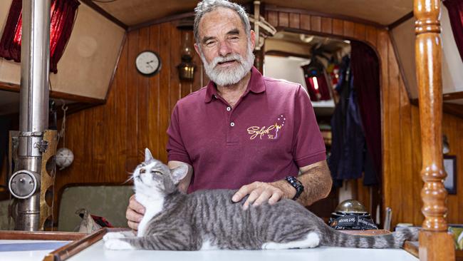 Bob Williams with his cat Oli on board Sylph VI.