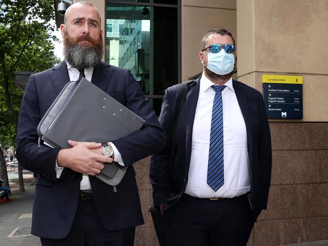 *ID CONFIRMED - MITCH RYAN* MELBOURNE, NOVEMBER 24, 2022: Former Cricket Australia head of communications Tim Whittaker, right, leaves Melbourne Magistrates Court with lawyer Mark Sturges. Picture: Mark Stewart