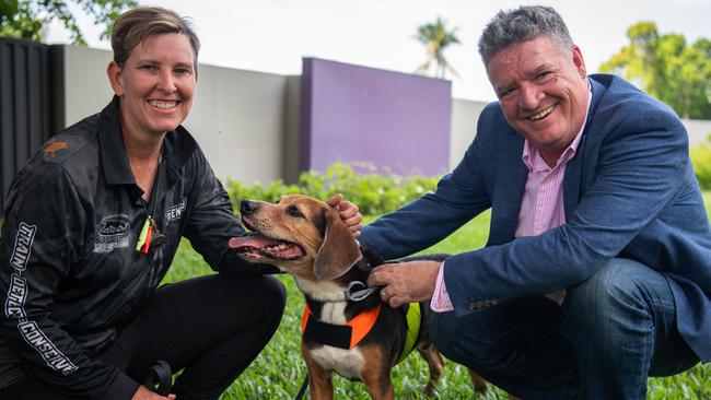 Agribusiness and Fisheries Minister Mark Monaghan with Zacc as introduced browser ant detection dogs alongside Top End Conservation Dogs representative Bronwyn Mullins at Berrimah Farms. Picture: Pema Tamang Pakhrin