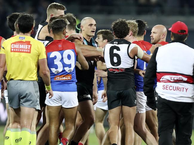 Port and Melbourne players remonstrate at half time. Picture: SARAH REED